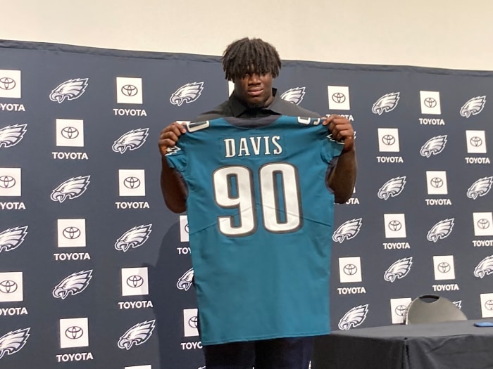 Jordan Davis displays his jersey after being picked 13th overall in the 2022 NFL Draft